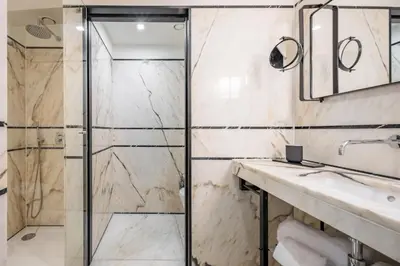 a bathroom with a shower and a sink at Descobertas Boutique Hotel by Aspasios in Porto