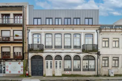 an old apartment building with white doors and windows at Topazio Apartment by Porto Stories in Porto