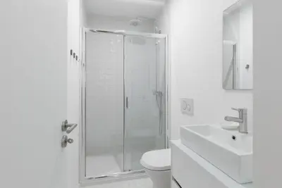 a bathroom with a shower and a toilet and a sink at OPorto Cosy and Modern Loft in Porto
