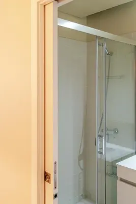 a bathroom with a shower with a glass door at Visconde de Gandara Apartment by Porto Stories in Porto