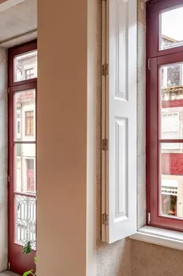 two windows on a wall next to each other at Visconde de Gandara Apartment by Porto Stories in Porto
