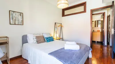 a kitchen with a sink and a refrigerator at Porto Essence Apartment in Porto