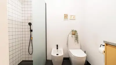 a bathroom with a toilet and a urinal at Porto Essence Apartment in Porto