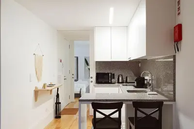 a bedroom with a bed with two towels on it at Great Flat & View in Historic Porto by LovelyStay in Porto