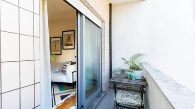 a balcony with a view of a living room at Adorable apartment 2D in Porto