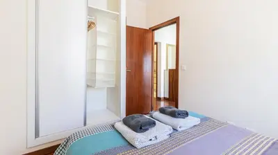 a bedroom with towels on top of a bed at Adorable apartment 2D in Porto