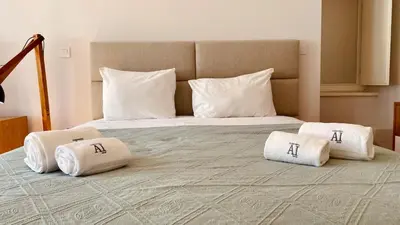 a large bed with two pillows on top of it at SM Apartments in Porto
