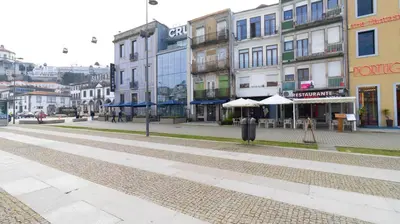an empty street in a city with buildings at Trendy 2BR Near Douro River by LovelyStay in Vila Nova de Gaia
