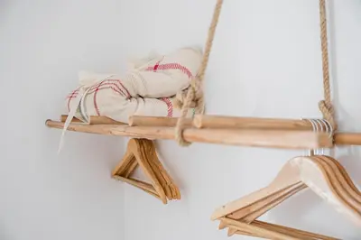 a person sitting on a wooden swing at GuestReady - Oporto Old Town House 3 in Porto