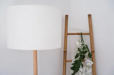 a lamp and a flower arrangement on a ladder at GuestReady - Oporto Old Town House 2 in Porto