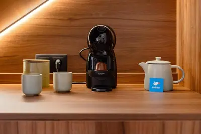 a cupboard under the stairs with mugs on it at Porto Center Duplex | Edifício Terracotta in Porto