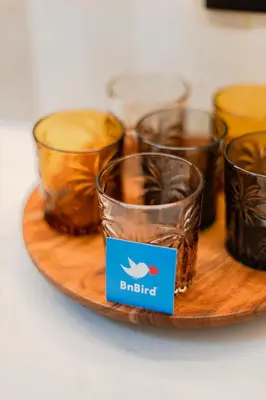 a coffee maker on a wooden counter with two cups at Porto Center Duplex | Edifício Terracotta in Porto
