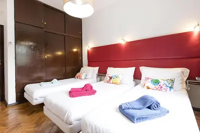 two beds in a room with towels on them at LV Premier Apartments Clerigos-RE2 in Porto