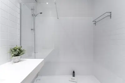 a bedroom with a large white bed and a large window at GuestReady - Old City Design Apartments in Porto