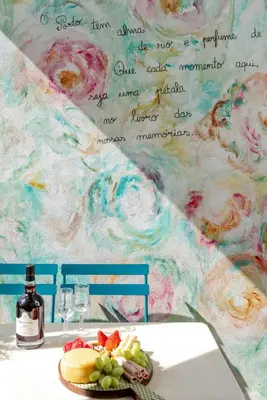 a table with a plate of grapes and a bottle of wine at Stylish Studio w/ Charming Terrace by HostWise in Porto
