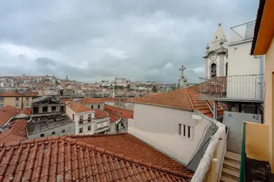 a large white bed with three pillows on it at House River View by Best2Stay in Vila Nova de Gaia