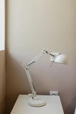 a white lamp sitting on top of a table at Downtown Refuge Camões in Porto