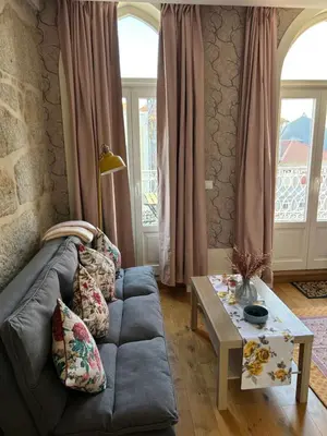 a living room with a couch and a table at Lazarus View Apartment in Porto