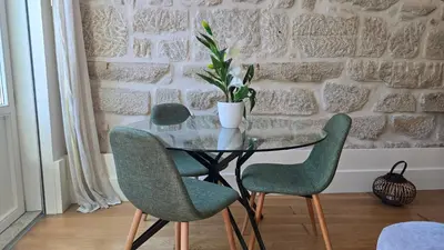 a living room with two couches and a flat screen tv at Pink Lux Apartments in Porto