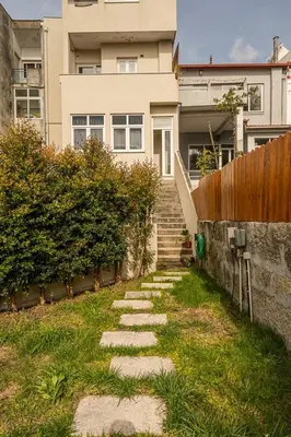 a stepping stone path in front of a house at GuestReady - One perfect home near the city centre in Porto