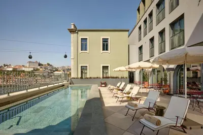 a swimming pool on the roof of a building at Origine Porto Gaia, a Tribute Portfolio Hotel in Vila Nova de Gaia