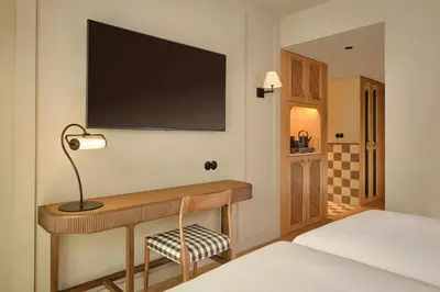 a bedroom with a large white bed and a balcony at Origine Porto Gaia, a Tribute Portfolio Hotel in Vila Nova de Gaia
