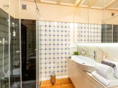 a bathroom with a sink and a shower at Studio near Ribeira do Porto in Porto