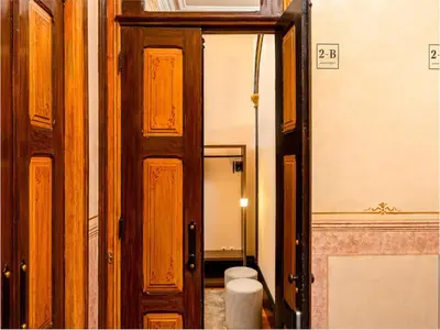an open door to a bathroom with a toilet at Beautiful apartment in the heart of Oporto in Porto