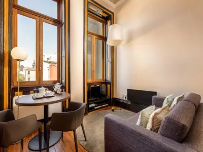 a living room with a couch and a table at Beautiful apartment in the heart of Oporto in Porto