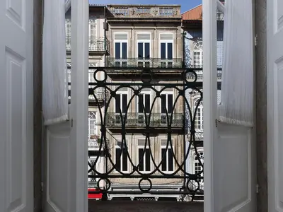 a view of a building from an open window at Studio with balcony in Oporto in Porto