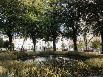 a pond in the middle of a park with trees at Charming 1-Bedroom Apartment in Gaia in Porto