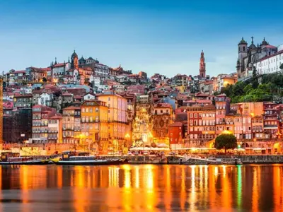 a city street with a statue in front of buildings at Well-equipped apartment in Oporto in Porto