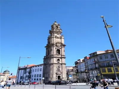 a tall clock tower in the middle of a city at Pretty apartment with modern comforts in Porto
