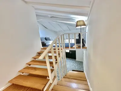 a staircase leading to a bedroom in a house at Charming apartment in Porto s Center in Porto