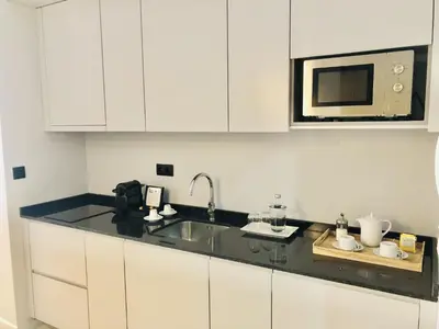 a kitchen with a sink and a microwave at Convenient apartment in the heart of Porto in Porto