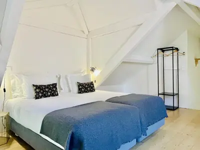 a living room with two chairs and a couch at Trendy Studio in the Heart of Porto in Porto