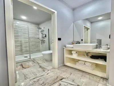 a bathroom with a sink and a toilet and a shower at Bright apartment near Bolhao metro station in Porto