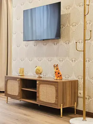 a living room with a television on a wall at Ninho Santa Catarina in Porto
