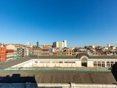 a view of a city from the roof of a building at Central Porto Stay with Balcony in Porto