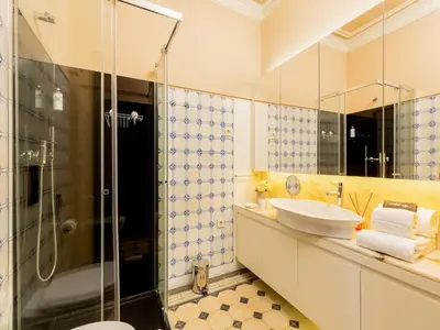 a bathroom with a sink and a shower at Cozy Studio in Porto with Modern Amenities in Porto