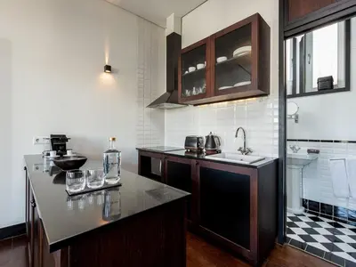 a kitchen with a sink and a counter top at Charming Apartment with street-view in Porto in Porto