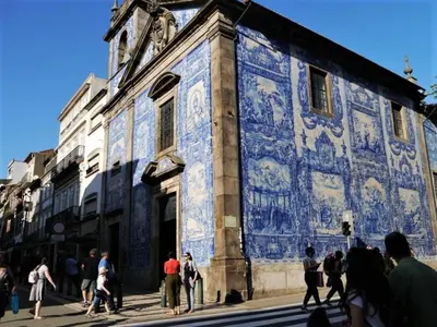 a group of people standing outside of a building with blue tiles at Beautiful apartment near Oporto city centre in Porto