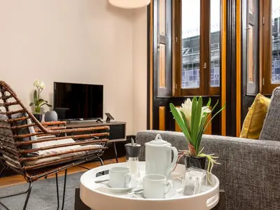 a living room with a couch and a coffee table at Spacious Modern Apartment in Porto in Porto