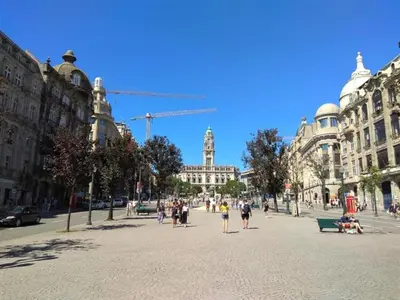 a group of people walking on a city street at Urban apartment with Balcony in Porto in Porto
