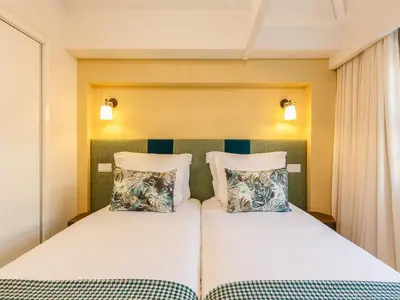 a bedroom with two beds and two pillows at River-View Retreat in Porto in Porto
