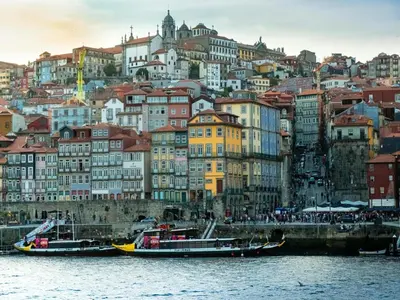 a group of boats in the water in front of a city at River-View Retreat in Porto in Porto