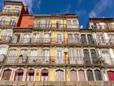 a tall building with balconies on the side of it at River-View Retreat in Porto in Porto