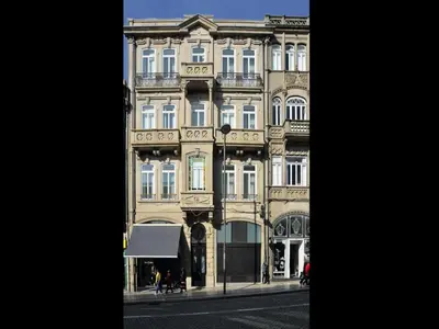 a large building on the side of a street at Cozy and modern apartment in Porto in Porto