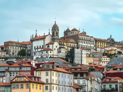 a group of buildings on top of a hill at Apartment near São Bento train station in Porto