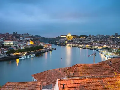 a view of a river with buildings and a city at Apartment near São Bento train station in Porto